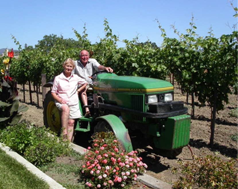 ALDO AND CLEMENTINA BIALE on tractor in vineyard