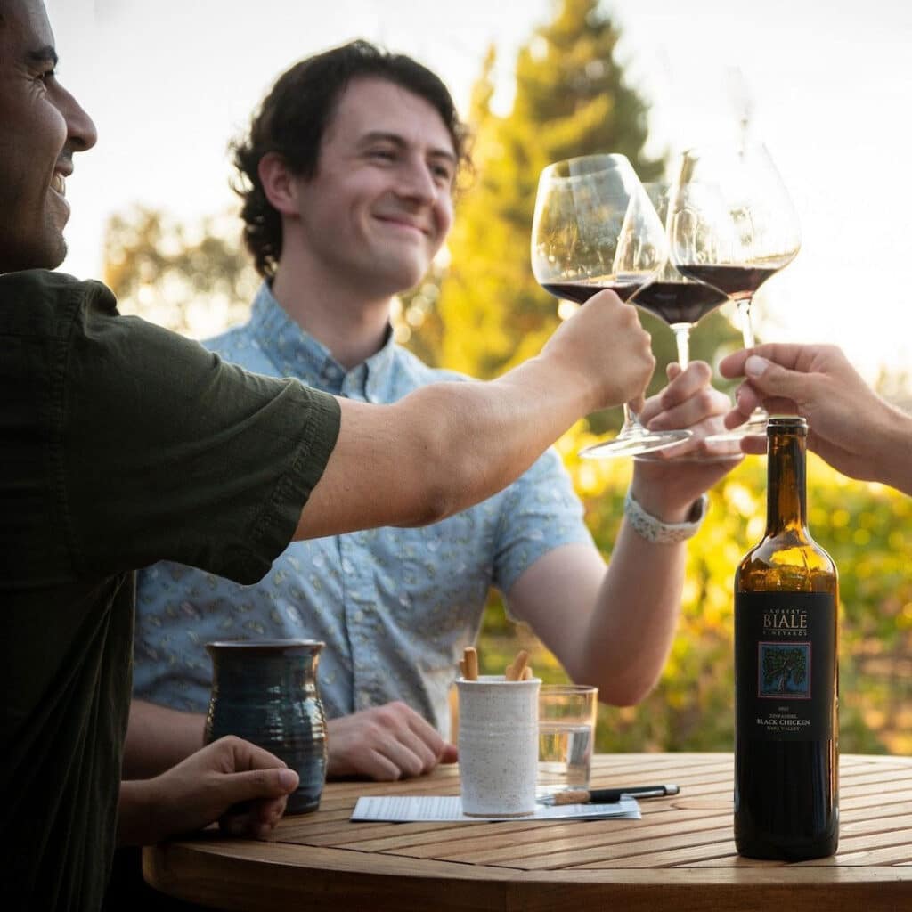 group of friends raising a glass of wine